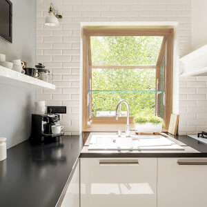 Contemporary lacquered kitchen interior with white brick wall